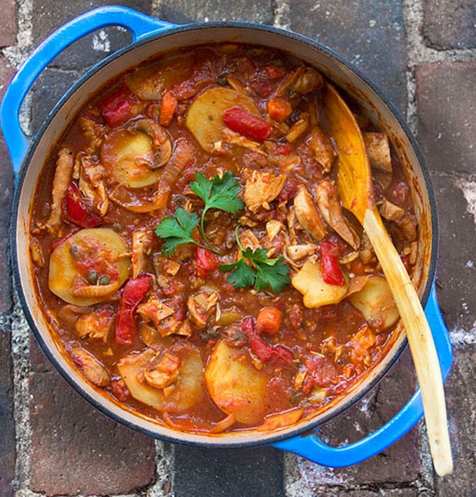 Chicken Cacciatore with Roasted Vegetables and Potatoes: a new take on Chicken Cacciatore, a rustic stew of tender boneless chicken, simmered with wine, tomatoes, carrots, mushrooms, roasted peppers and potatoes.
