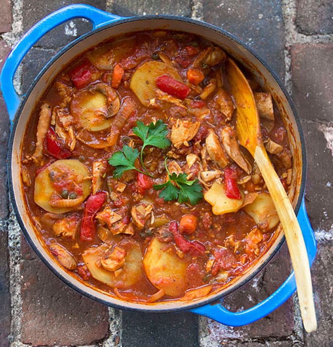 Chicken Cacciatore with Roasted Vegetables and Potatoes: a new take on Chicken Cacciatore, a rustic stew of tender boneless chicken, simmered with wine, tomatoes, carrots, mushrooms, roasted peppers and potatoes. 