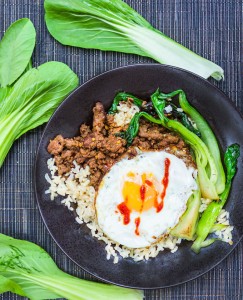 It takes just 20 minutes to make this super flavorful, healthy dinner recipe: Thai Beef Bok Choy Rice Bowl with an egg on top. Add your favorite hot sauce!