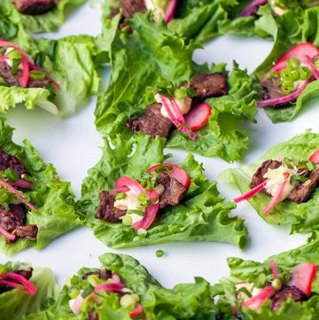 These Korean Beef Lettuce Wraps are fantastically flavorful. Pan seared beef tenderloin in scrumptious Bulgogi marinade, wrapped up in lettuce leaves with homemade picked onions and radishes and miso mayonnaise. Serve as an appetizer or main dish.