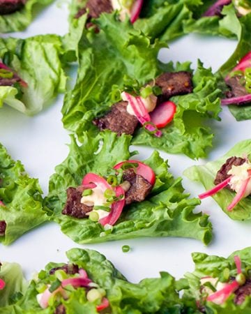 These Korean Beef Lettuce Wraps are fantastically flavorful. Pan seared beef tenderloin in scrumptious Bulgogi marinade, wrapped up in lettuce leaves with homemade picked onions and radishes and miso mayonnaise. Serve as an appetizer or main dish.