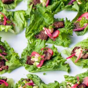 Korean beef lettuce wraps with pickled red onions.