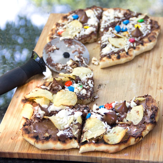 2 Grilled Chocolate Pizzas topped with colorful m & m's, chocolate kisses, and potato chips. 