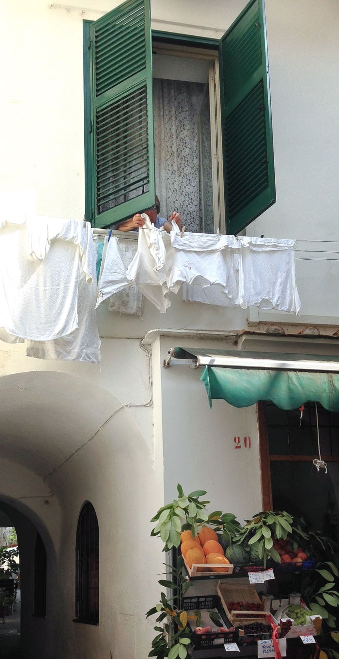 woman hanging wash in Amalfi