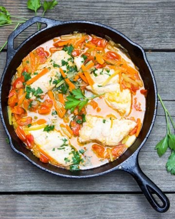 Fish in crazy water is a classic Neopolitan dish of fresh fish, poached with carrots, celery, onions and tomatoes. The fish is tender, the veggies are crisp-tender, the broth is sweet and delicious, and dinner is on the table in just 30 minutes.