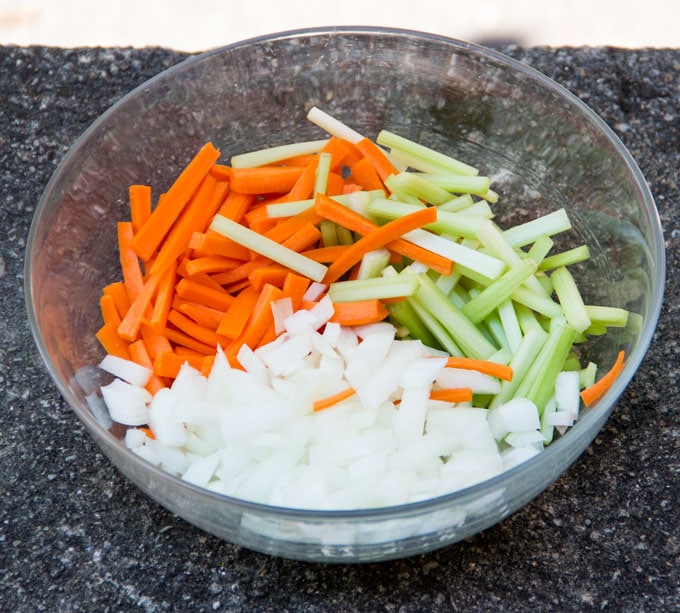 matchstick cut carrots, celery and onions in a bowl, ready for cooking fish in crazy water