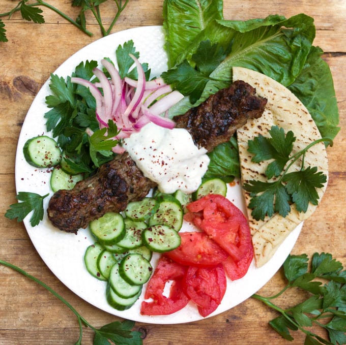 Every Middle Eastern country has a version of grilled Kofta Kebabs. It's hard to imagine anything more delicious! Especially with garlicky yogurt sauce! This recipe shows you how to make authentic Turkish Kofta Kebabs at home.
