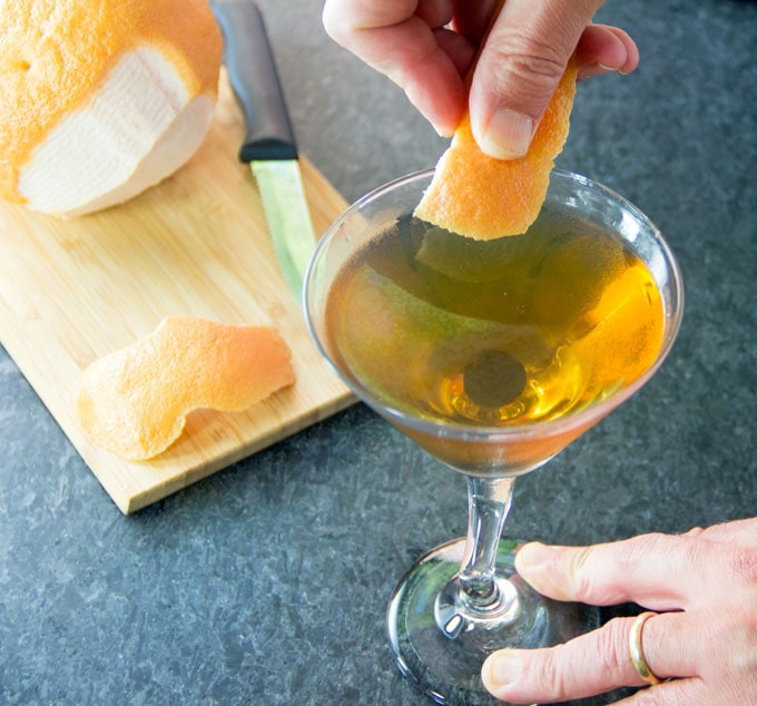 flavoring the rim of a martini glass by rubbing it with grapefruit peel