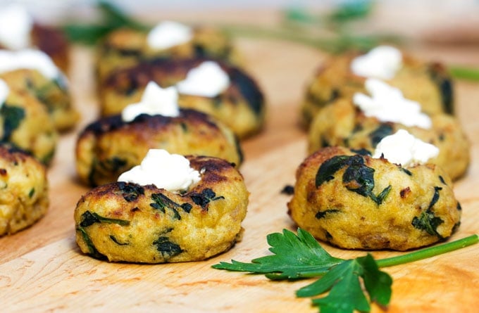 Mini Spinach Potato Knish Appetizer. Little baked puffs of mashed potato, caramelized onion and spinach.