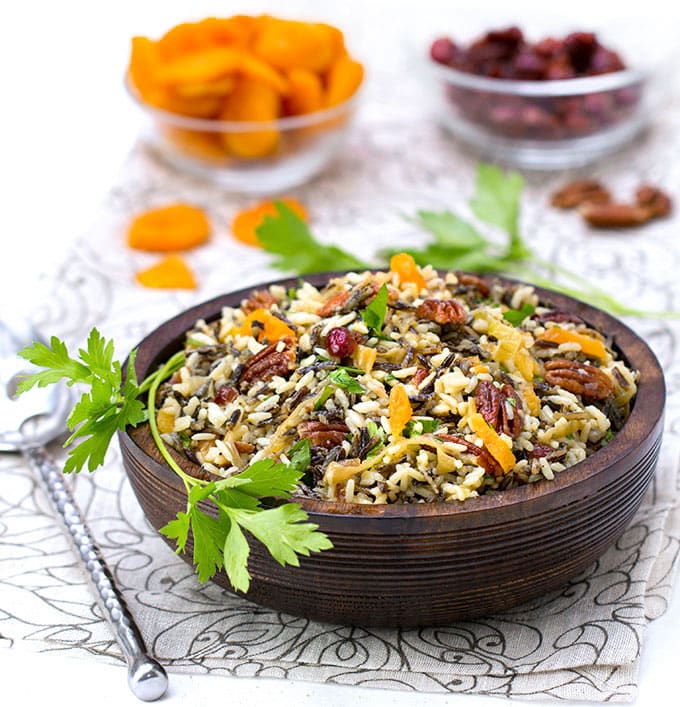This wild rice salad is bejeweled with cranberries, apricots and pecans and dressed with orange shallot vinaigrette. It's The perfect side dish for Thanksgiving or any festive meal.