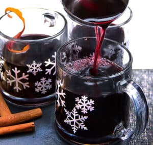 snowflake mugs filled with Swedish Glögg. delicious hot spiced mulled wine and spirits
