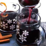 snowflake mugs filled with Swedish Glögg. delicious hot spiced mulled wine and spirits