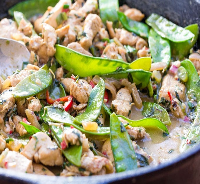 Fresh ginger, coconut milk and basil are the base of this fragrant Thai green curry chicken recipe. Fluffy white rice is all you need to complete the meal. Perfect for weeknights when you want something quick and delicious.