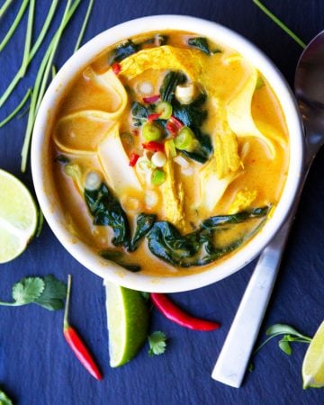 This creamy, fragrant, DELICIOUS Thai coconut curry chicken soup has spinach and rice noodles and everything you want for dinner, all in one pot!