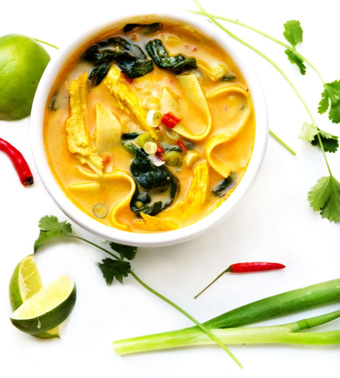 This creamy, fragrant, DELICIOUS Thai coconut curry chicken soup has spinach and rice noodles and everything you want for dinner, all in one pot!