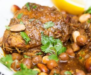 This elegant Moroccan Chicken Tagine recipe is perfect for the slow cooker. The chicken tenderizes as it absorbs the fragrant North African spices and fills the house with the most delicious aromas. There's plenty of sauce and chickpeas to spoon over the chicken and a bed of rice or couscous.