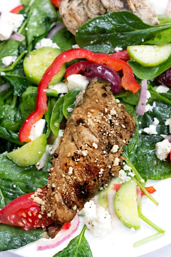 Greek spinach salad topped with lemon garlic marinated grilled turkey tips and cubes of salty feta is a fabulous, healthy weeknight dinner recipe.