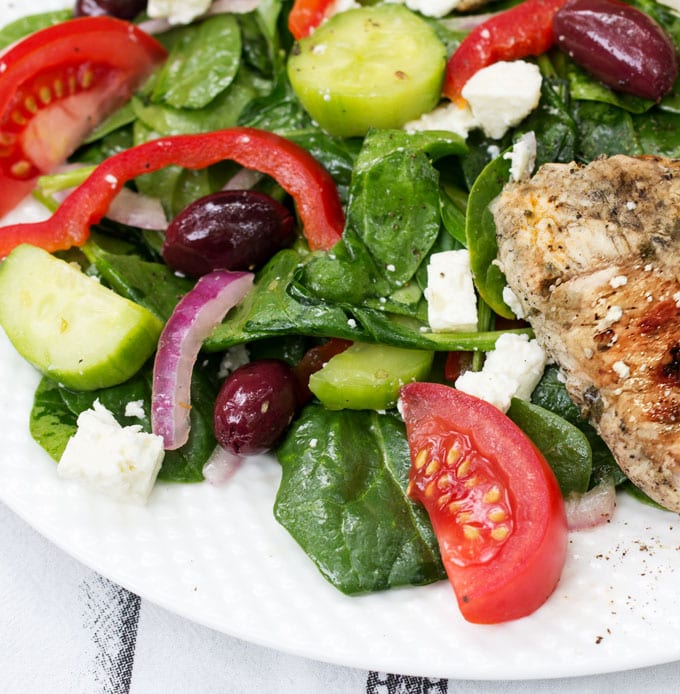 Greek spinach salad topped with lemon garlic marinated grilled turkey tips and cubes of salty feta is a fabulous, healthy weeknight dinner recipe.