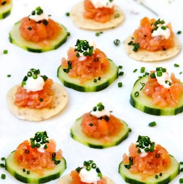 Smoked Salmon Tartare: An easy elegant appetizer in ten minutes. A total crowd pleaser. Serve on cucumber rounds and rice crackers. Top with sour cream and chopped chives