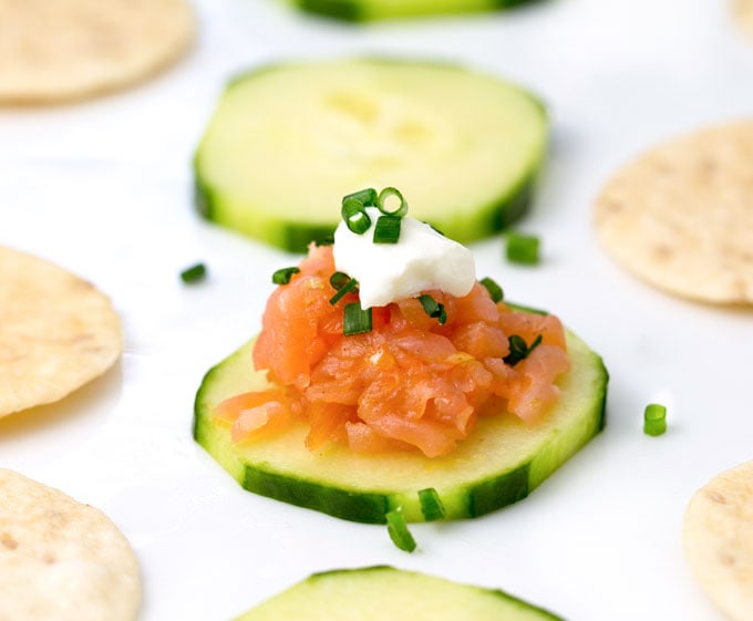 Smoked Salmon Tartare: An easy elegant appetizer in ten minutes. A total crowd pleaser. Serve on cucumber rounds and rice crackers. Top with sour cream and chopped chives