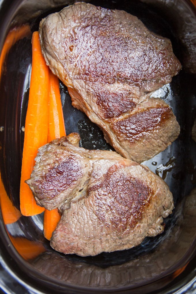 Ropa Vieja meat in a slow cooker with carrots