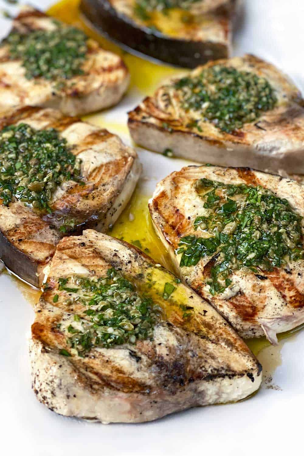 6 grilled swordfish steaks topped with salsa verde.