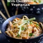 bowl filled with sesame coated linguine noodles, topped with matchstick cucumbers and carrots, sliced scallions and sesame seeds.