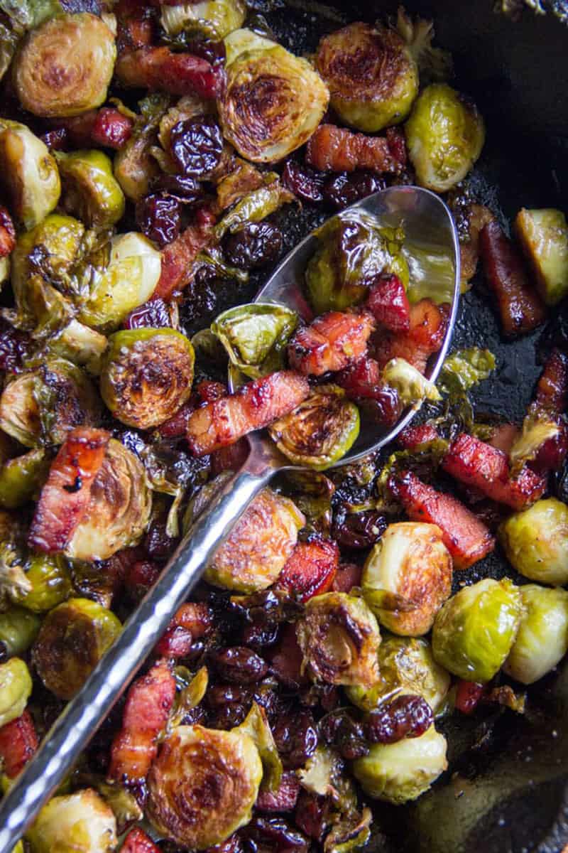 close up of brussels sprouts with bacon and dried cherries