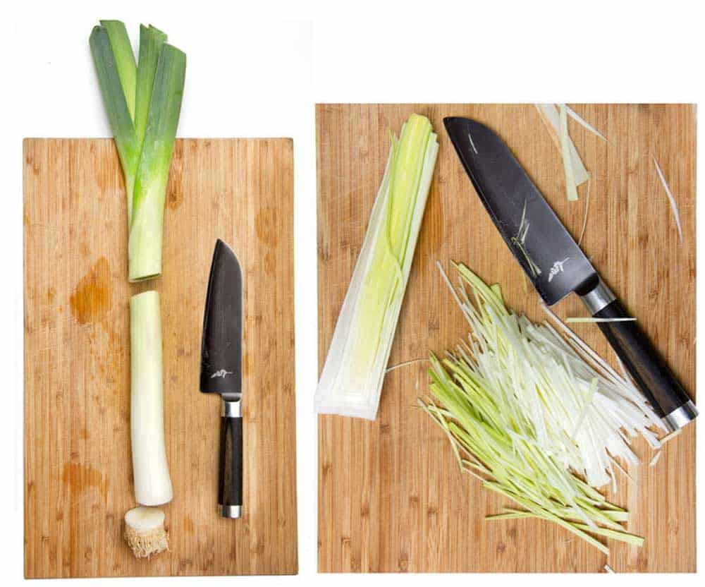 leeks and a knife on a cutting board, and slivered leeks on a cutting board