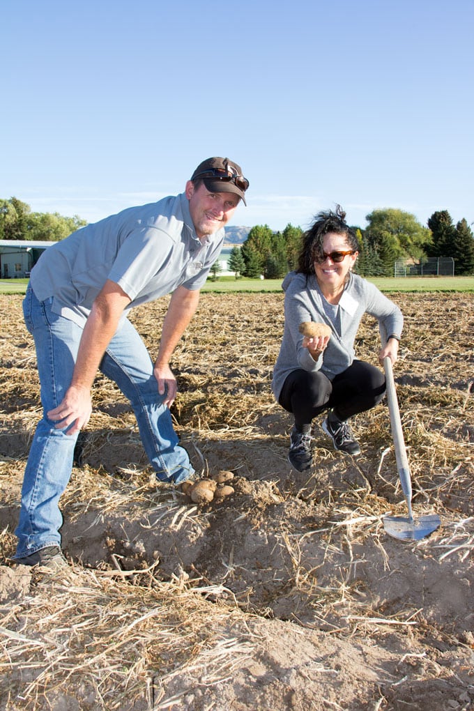 Lisa Goldfinger with James Hoff, digging potatoes on Hoff Brother's Farm, Idaho Falls, Idaho