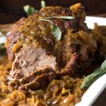 Pork Roast with Sauerkraut Apples and Onions is a delicious festive dish that takes only 5 ingredients and 20 minutes of prep. It's easy enough for Sunday dinner and special enough for New Year's Eve.