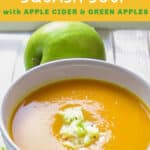 pinterest pin: bowl of curried butternut squash soup with a green apple in the background