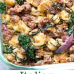 sausage and bread stuffing with broccoli rabe and red onions in a glass casserole
