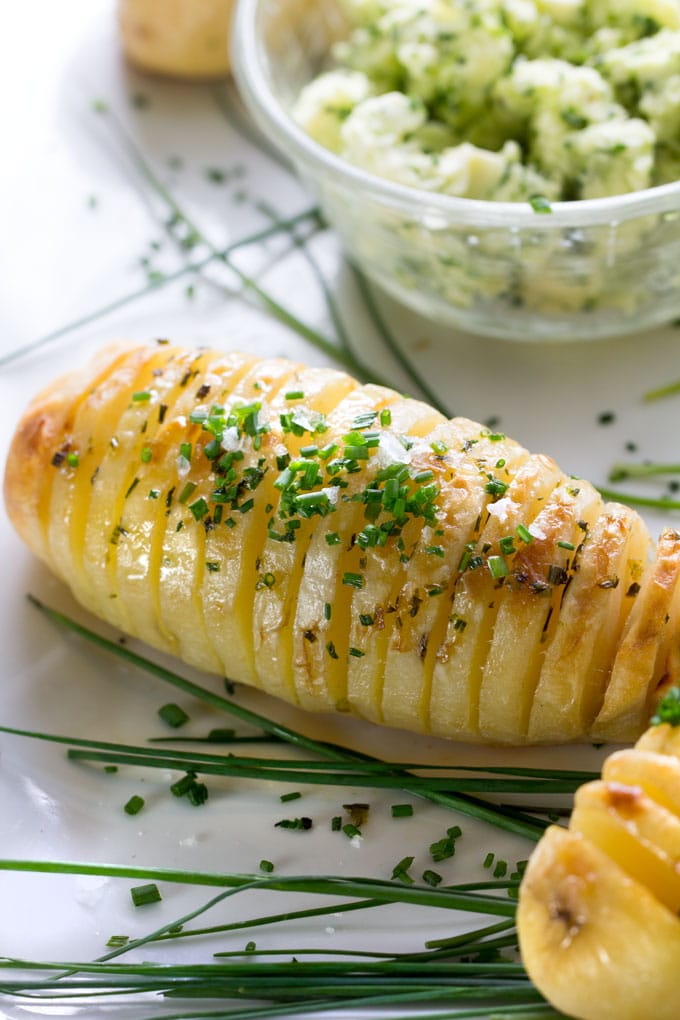 Holiday Hasselback Potatoes are the perfect holiday side dish, especially when they're basted with shallot chive butter while they cook!