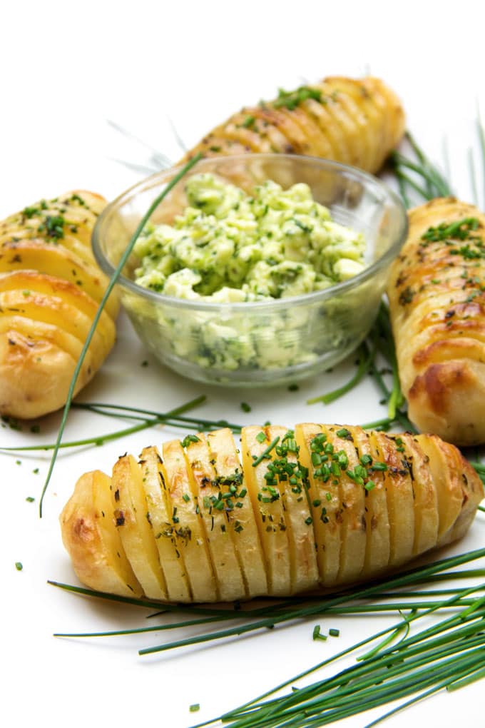 Holiday Hasselback Potatoes are the perfect holiday side dish, especially when they're basted with shallot chive butter while they cook!