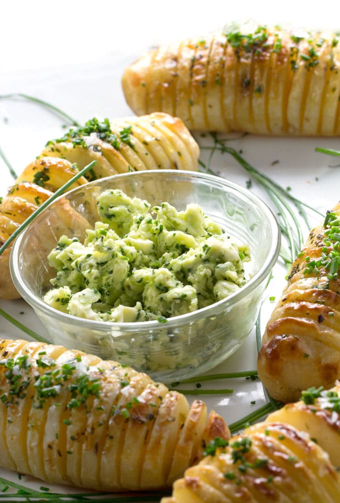 Holiday Hasselback Potatoes are the perfect holiday side dish, especially when they're basted with shallot chive butter while they cook!