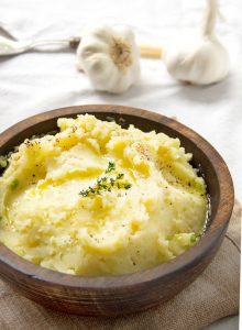 These olive oil and roasted garlic mashed potatoes are creamy and absolutely delicious, with no butter or cream. Roasted garlic and fruity olive oil, give these dairy-free, vegan mashed potatoes their great flavor and texture.