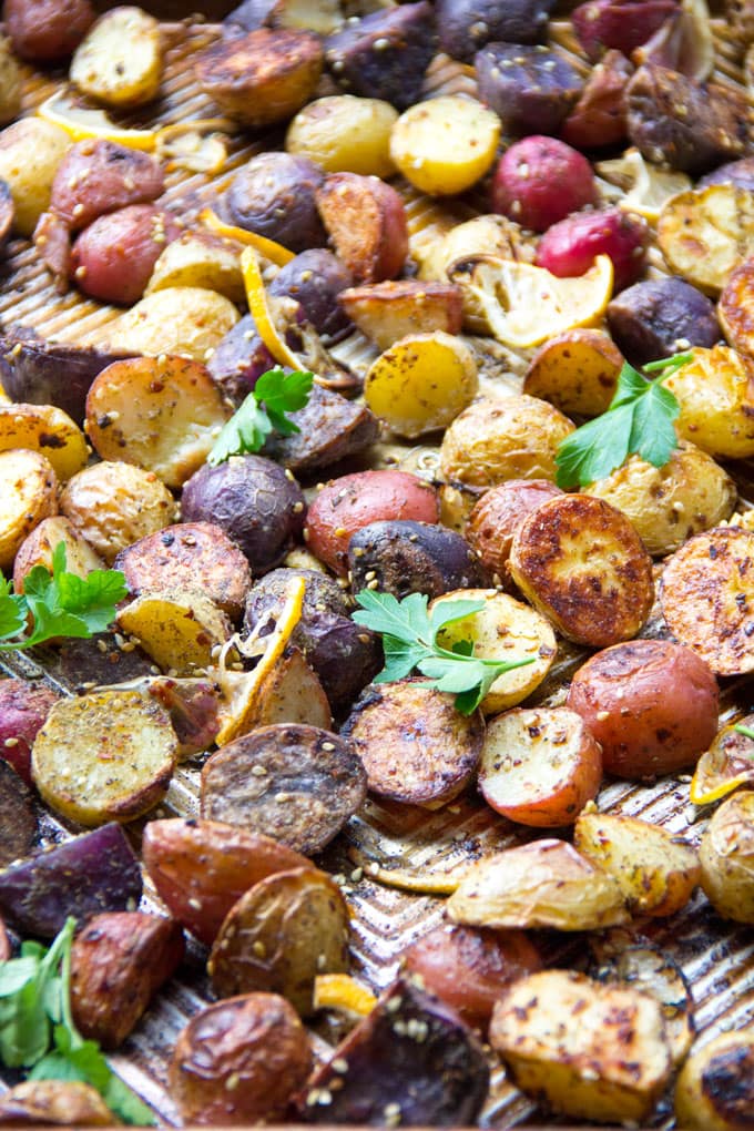 These colorful roasted potatoes are deliciously crisp on the outside and creamy inside. The amazing flavors of Middle Eastern za'atar, red pepper and fresh lemon, are baked in. They're extra good drizzled with lemony tahini sauce. 