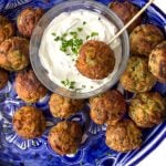 These Savory Potato Aebleskivers are potato pancakes like you've never had them before. The batter is made from tender red lentils, shredded potatoes, herbs and chilies. The pancakes are cooked in a special pan that forms them into golden brown spheres that are crisp on the outside, fluffy and tender inside. Serve these scrumptious bites as a party appetizer or a game day snack. As a bonus, these potato aebleskivers are gluten-free, dairy-free, and egg-free.