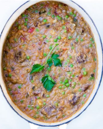 This Minestrone soup is a hearty one pot dinner, with lots of fresh vegetables, tomatoes, white beans, red lentils and beef short ribs. The beef is fall-apart tender and the lentils melt into the delicious broth and give it a rich creamy texture. {gluten-free}