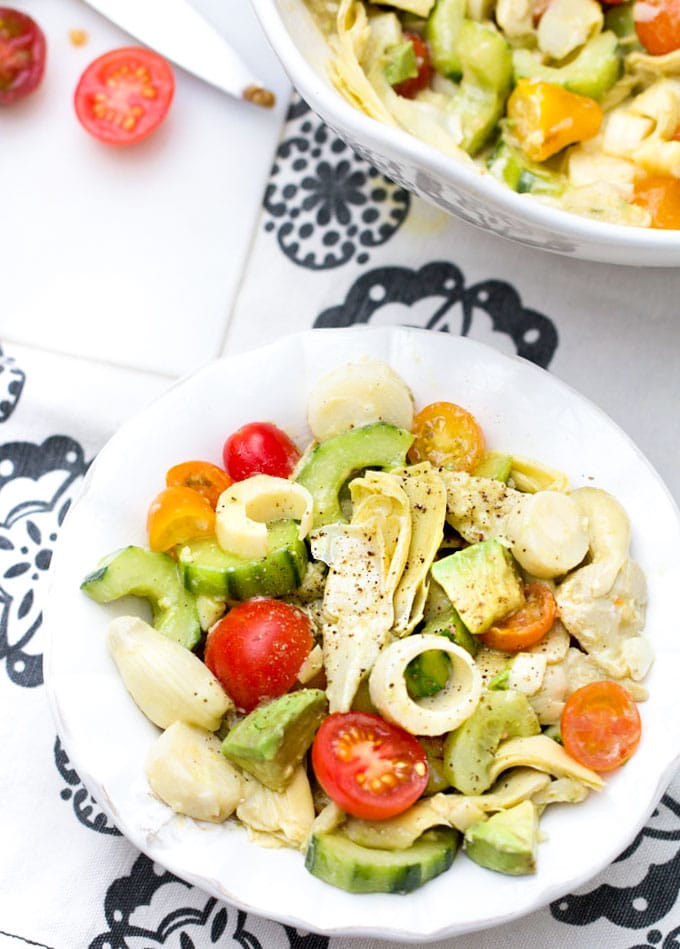 hearts of palm salad with artichoke hearts, cucumbers, avocados and cherry tomatoes