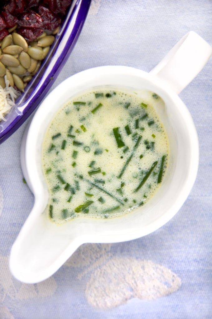 Herb buttermilk dressing in a white pitcher