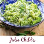 sautéed shredded zucchini in a blue bowl with basil leaves to garnish