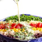 This is a wonderful main dish chopped salad recipe with a rainbow of healthy ingredients and a bright, tangy buttermilk dressing. Easily vegetarian or gluten-free | panningtheglobe.com