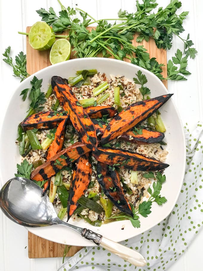 Here's a fabulous technique for cooking sweet potato wedges to perfection without frying them. Crisp and caramelized outside, sweet and tender inside, firm enough to hold up to a salad or to grab in hand and dip into a tasty dressing or aioli. These are some seriously great grilled sweet potatoes!