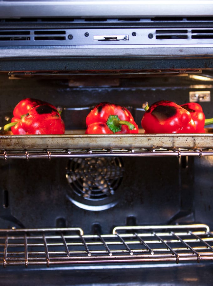 Roasted red peppers bear little resemblance to raw red bell peppers. The roasting process transforms them from firm and crunchy and to velvety soft and it brings out their natural sweetness. Whether you roast them in the oven or on the grill, the process is simple and totally satisfying. Homemade roasted peppers are exceptionally good - tender and fruity - way better than the kind you get in a jar.