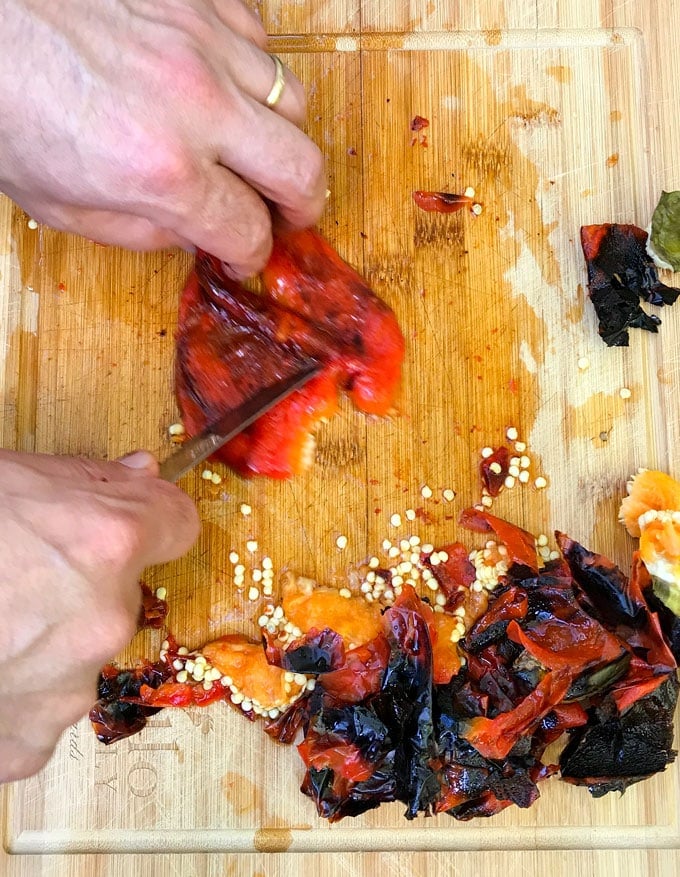 Roasted red peppers bear little resemblance to raw red bell peppers. The roasting process transforms them from firm and crunchy and to velvety soft and it brings out their natural sweetness. Whether you roast them in the oven or on the grill, the process is simple and totally satisfying. Homemade roasted peppers are exceptionally good - tender and fruity - way better than the kind you get in a jar.