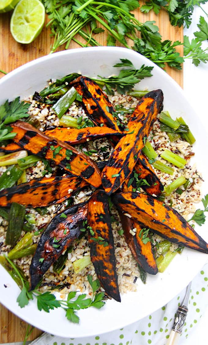 Grilled Sweet Potatoes: Here's a fabulous technique for cooking sweet potato wedges to perfection without frying them. Crisp and caramelized outside, sweet and tender inside, firm enough to hold up to a salad or to grab in hand and dip into a tasty dressing or aioli. These are some seriously great grilled sweet potatoes!