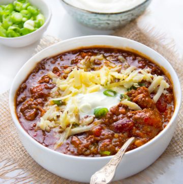 This Award Winning Chili recipe is hands down the BEST chili con carne I've ever tasted, with the most incredible flavor and texture - made with beef, pork, beans, awesome spices, onions, garlic, tomatoes and beer. Plus it freezes well so you might want to make a double batch.