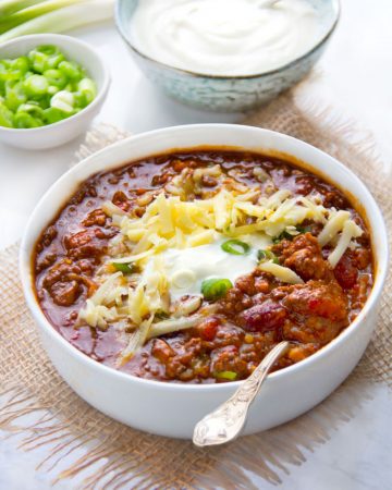 This Award Winning Chili recipe is hands down the BEST chili con carne I've ever tasted, with the most incredible flavor and texture - made with beef, pork, beans, awesome spices, onions, garlic, tomatoes and beer. Plus it freezes well so you might want to make a double batch.